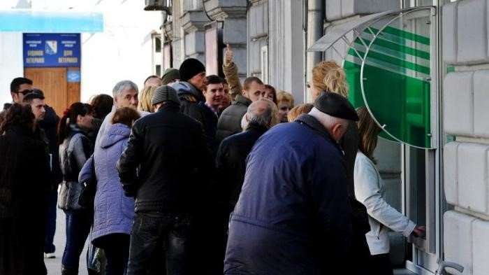 Як покласти гроші на карту Ощадбанку через банкомат готівкою?